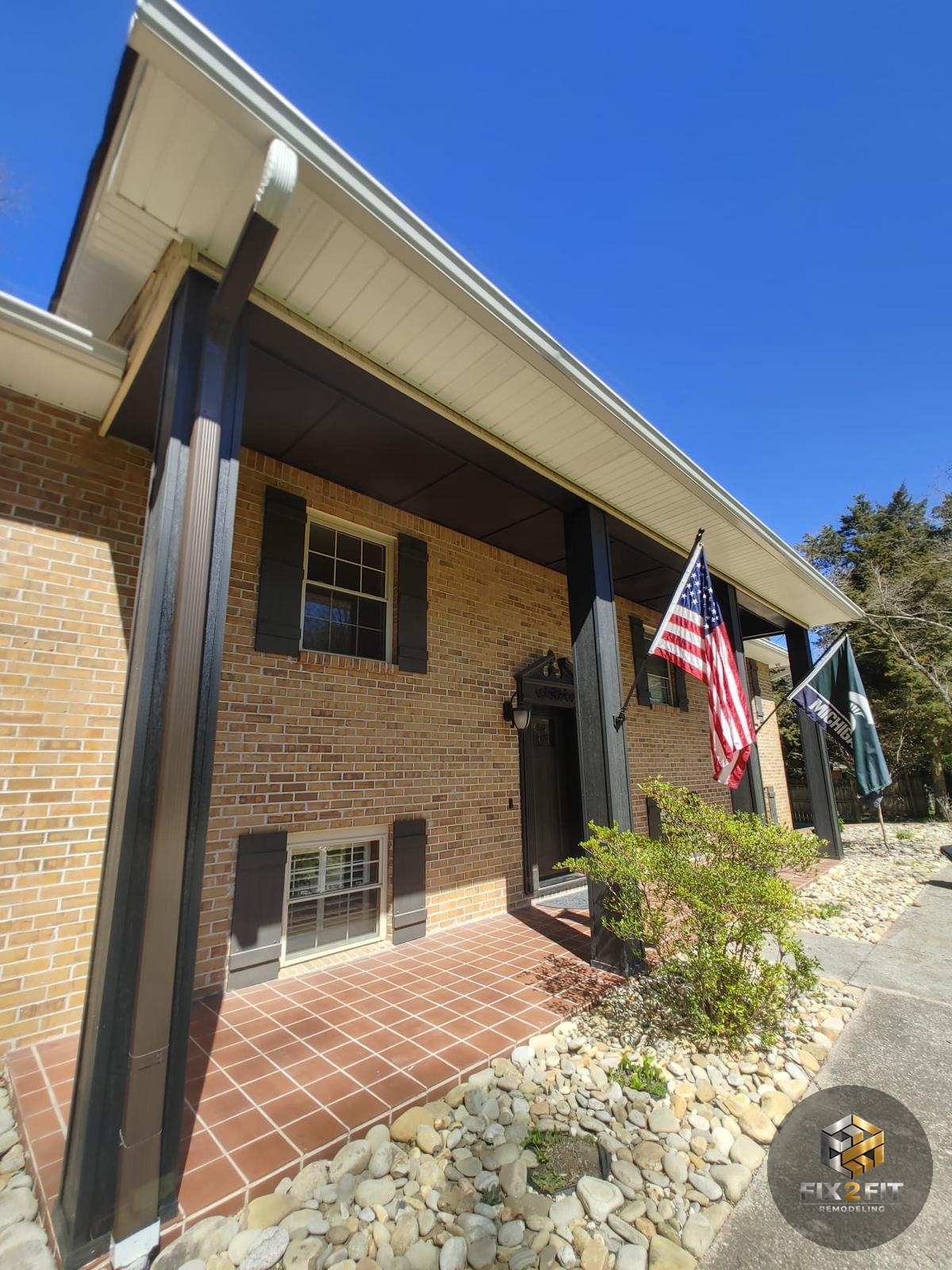Freshly painted exterior trim and porch columns on a brick home in Knoxville